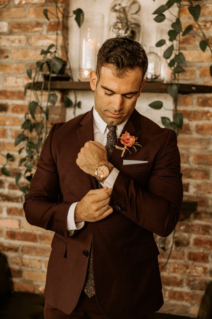 groom in suit with watch