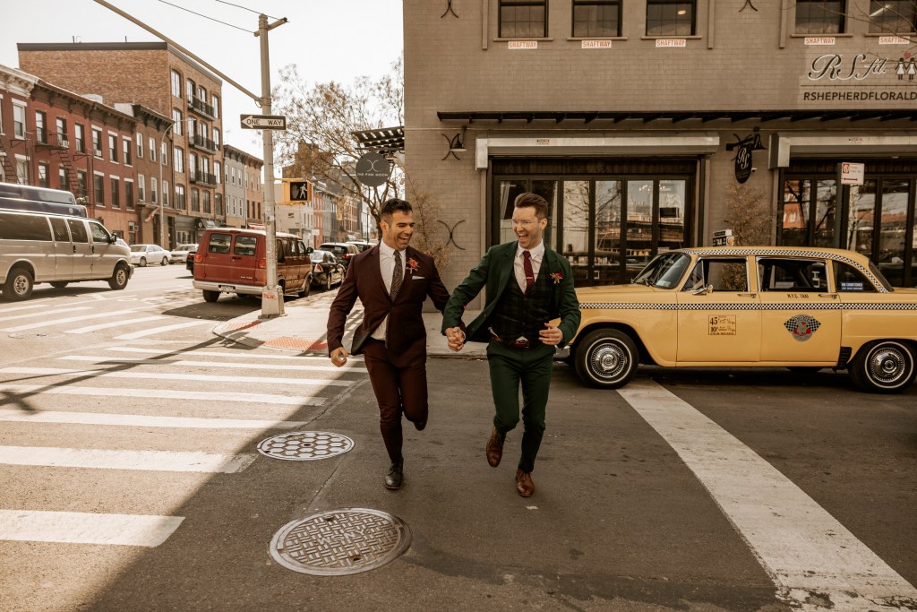 gay couple run across Brooklyn New York City street